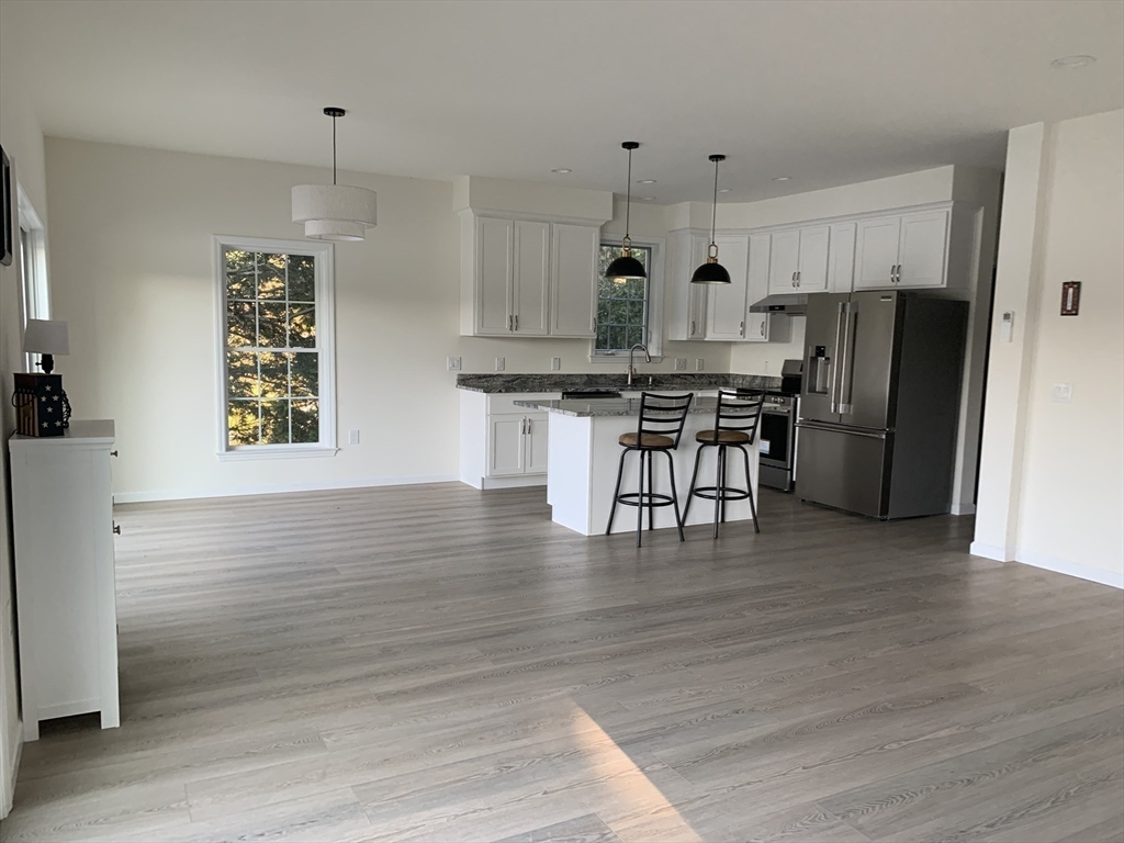 38 Stevens Park Road Charlton, MA 01507 - Photo 7 of 40 a kitchen with refrigerator and microwave