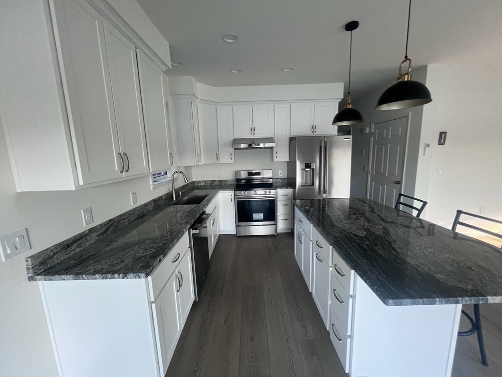 38 Stevens Park Road Charlton, MA 01507 - Photo 10 of 40 a kitchen with granite countertop a sink and a stove