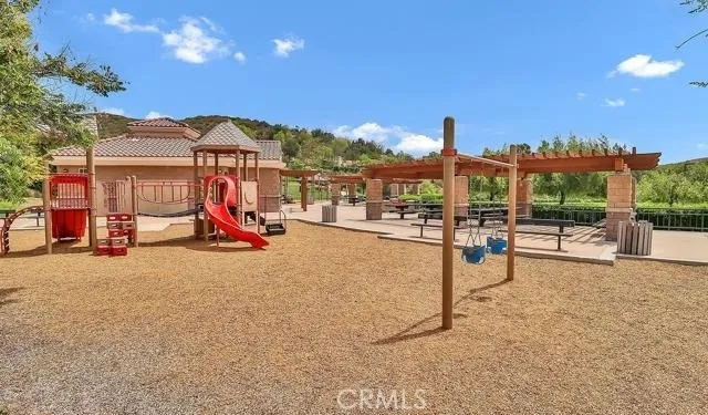 a view of a park with swings and slides