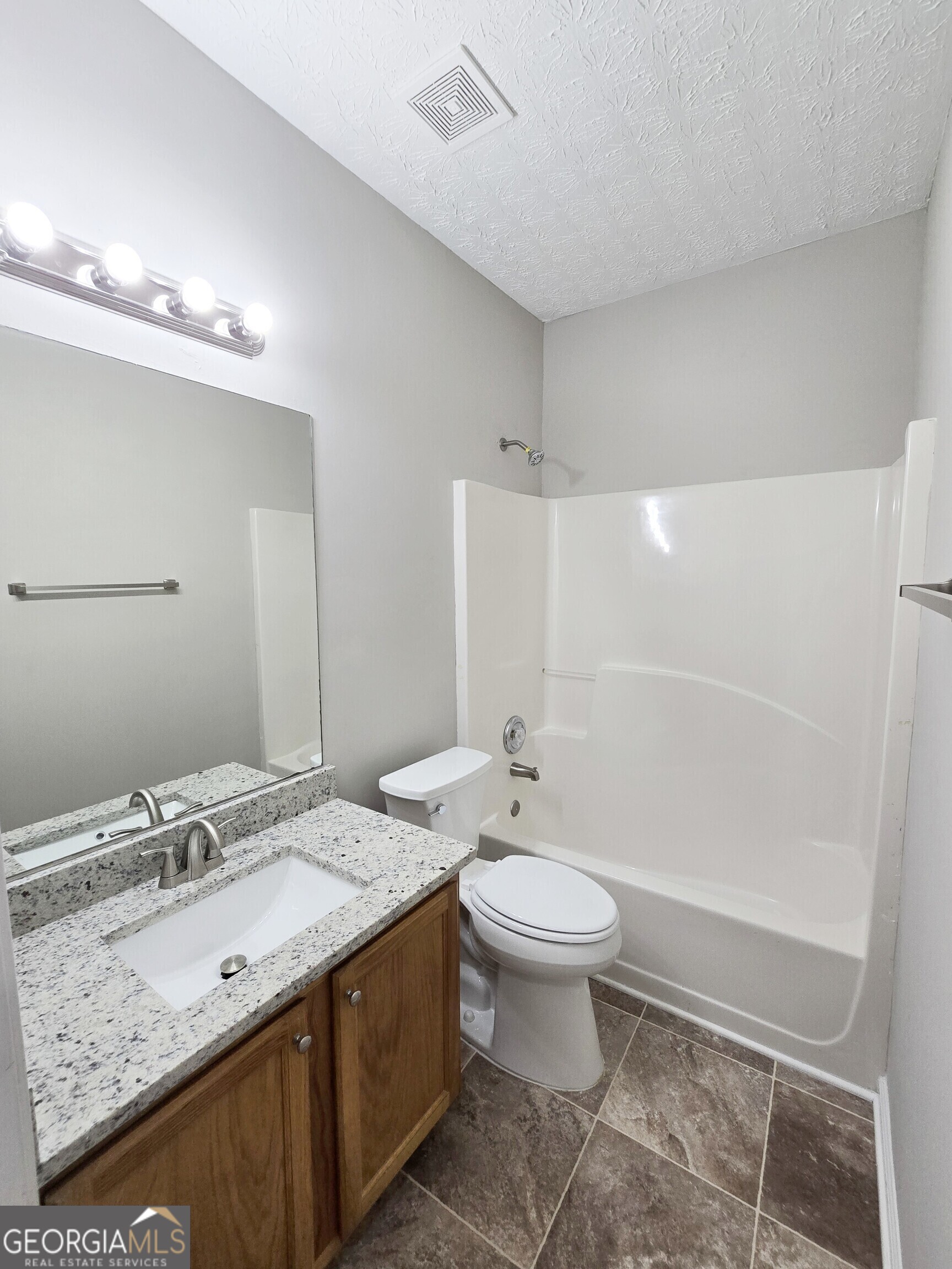 537 Goldfinch Way Stockbridge, GA 30281 - Photo 11 of 20 a bathroom with a double vanity sink mirror and toilet