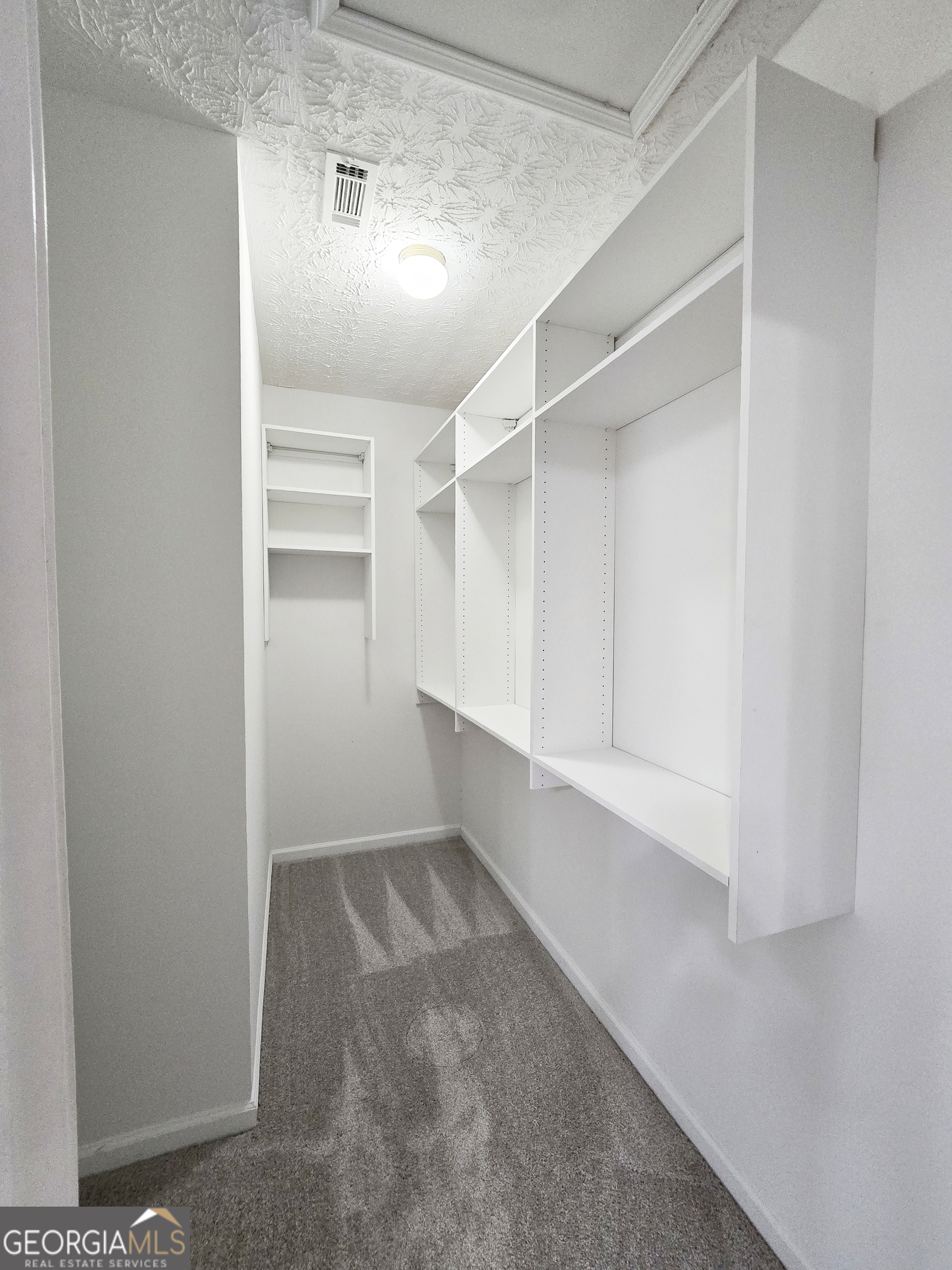 537 Goldfinch Way Stockbridge, GA 30281 - Photo 13 of 20 a view of an empty walk in closet