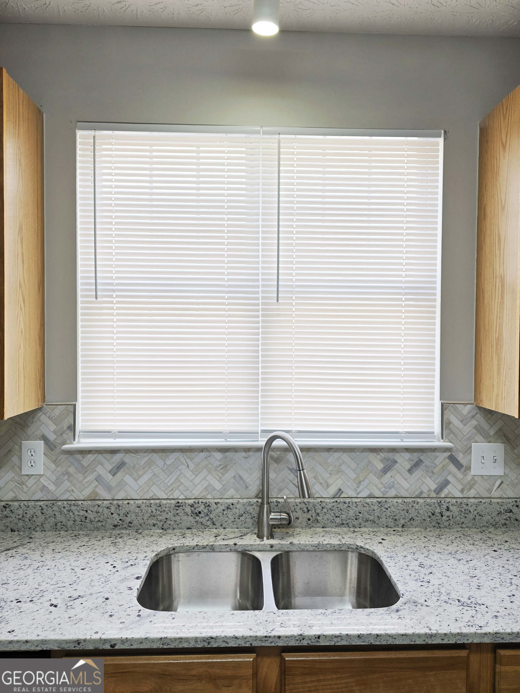 537 Goldfinch Way Stockbridge, GA 30281 - Photo 6 of 20 a kitchen sink with a window