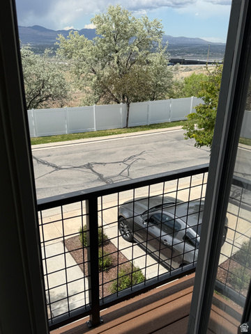 14797 South Chandlerpoint Way Draper, UT 84020 - Photo 31 of 33 Private balcony with a dark wood-finish deck and black metal grid railing