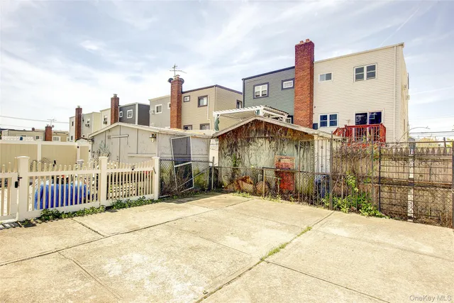 a view of a brick house with many windows