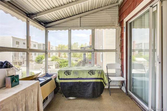 a spacious bedroom with a large bed and a large window