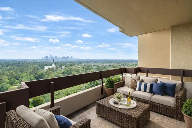 a view of a patio with couches and table and chairs