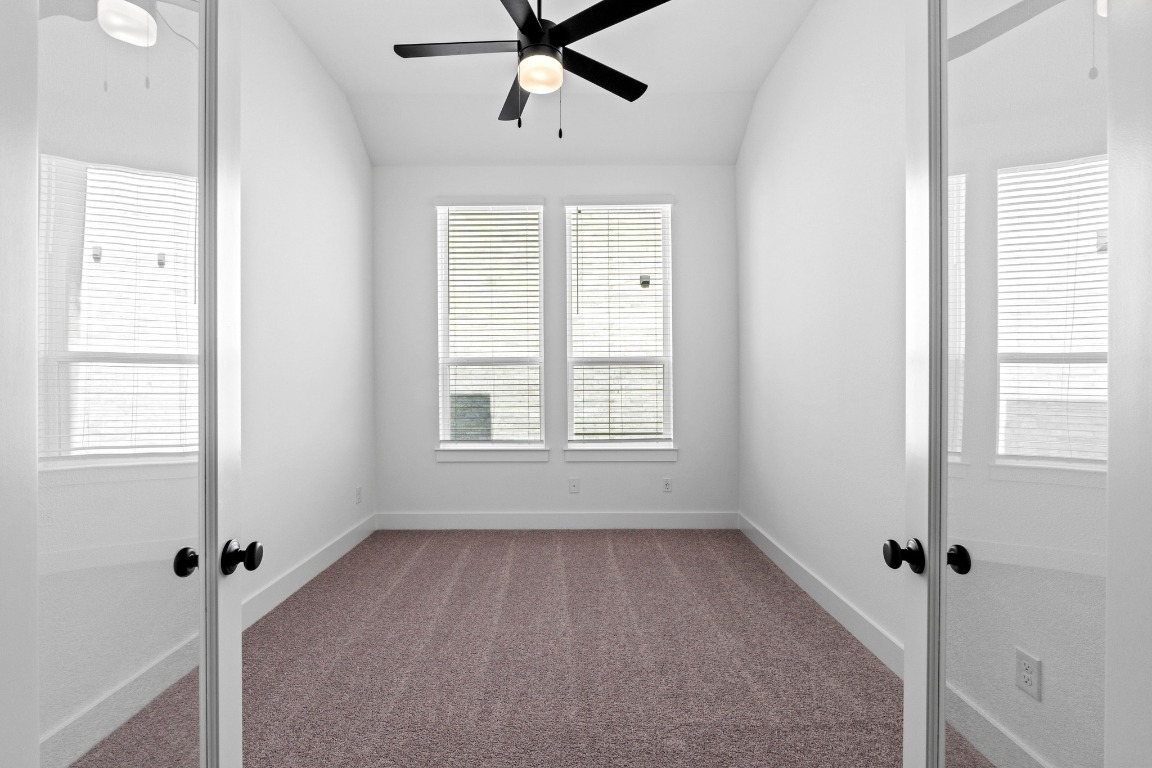 3209 Moon Ridge Road Georgetown, TX 78628 - Photo 18 of 28 a view of a room with a window and a ceiling fan