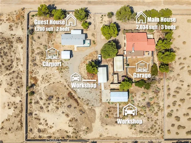 an aerial view of ocean and residential houses with outdoor space