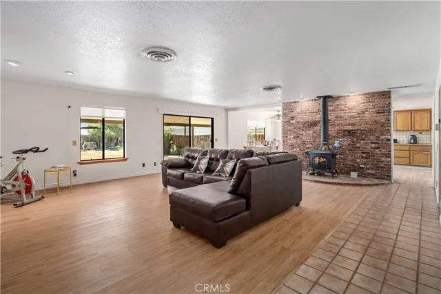 a view of a livingroom with workspace and a window