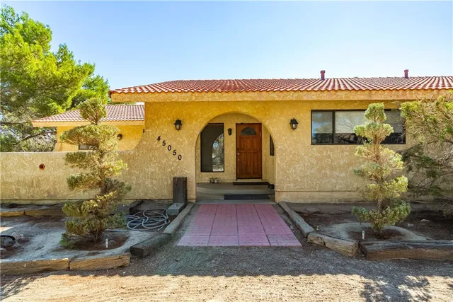 a bathroom with a sink a vanity and a mirror
