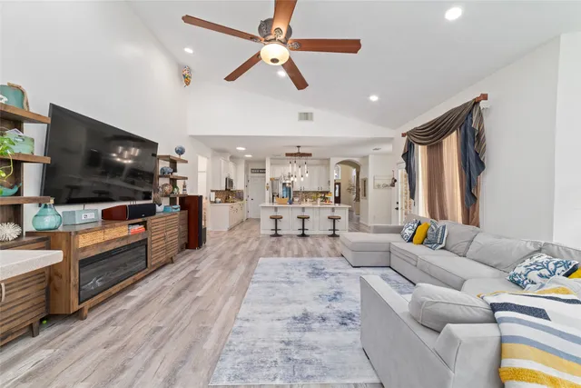 a living room with furniture and a large window