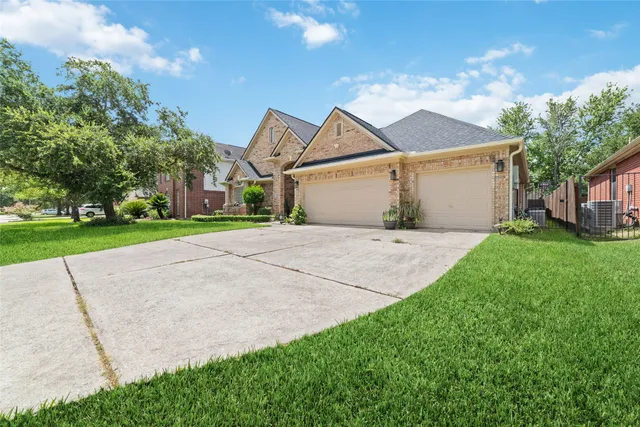 a view of a house with a yard and garage