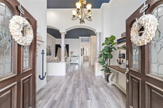 a view of a hallway with wooden floor