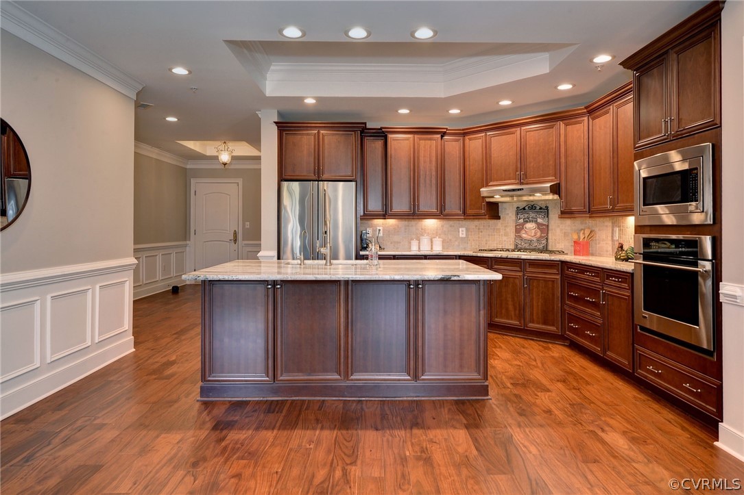 1103 Eaglescliffe Williamsburg, VA 23188 - Photo 12 of 50 a kitchen with stainless steel appliances kitchen island granite countertop a stove a sink and a microwave