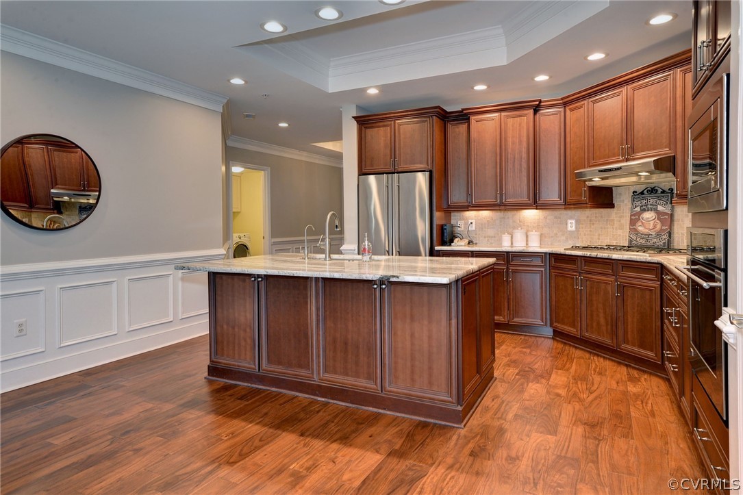1103 Eaglescliffe Williamsburg, VA 23188 - Photo 13 of 50 a kitchen with kitchen island granite countertop wooden cabinets a sink and a stove