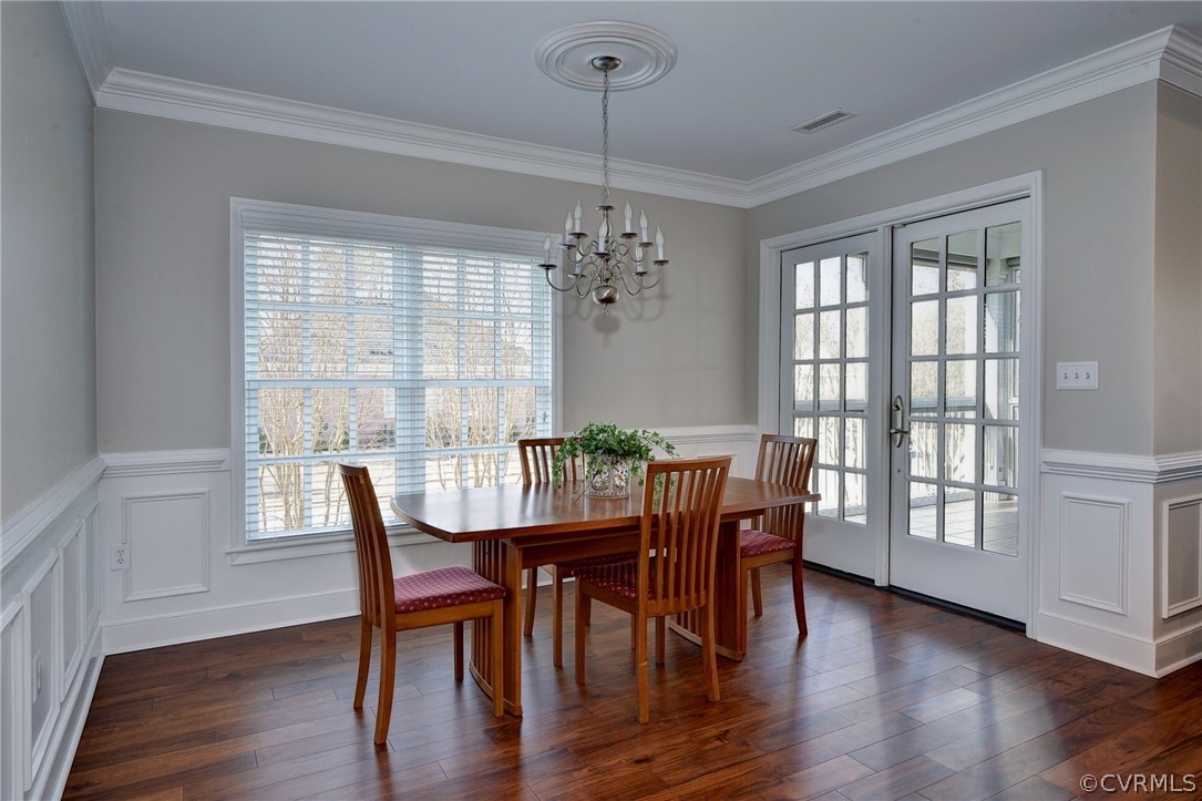 1103 Eaglescliffe Williamsburg, VA 23188 - Photo 15 of 50 a view of a dining room with furniture wooden floor and chandelier