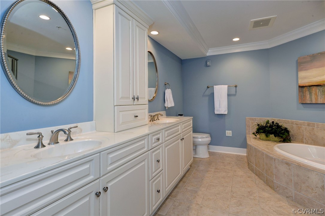 1103 Eaglescliffe Williamsburg, VA 23188 - Photo 22 of 50 a spacious bathroom with a double vanity sink a mirror and a