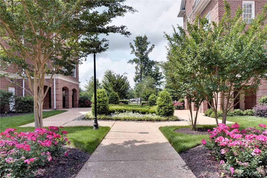 1103 Eaglescliffe Williamsburg, VA 23188 - Photo 43 of 50 a front view of a house with fountain and garden