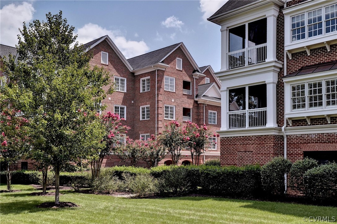 1103 Eaglescliffe Williamsburg, VA 23188 - Photo 47 of 50 a front view of a house with a yard and potted plants