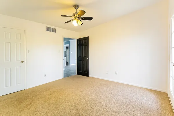 a view of a big room with carpet