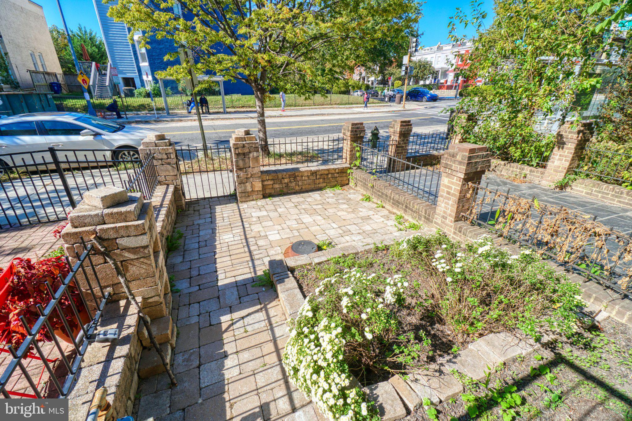 935 8th Street Northeast Washington, DC 20002 - Photo 4 of 19 Charming garden entrance with brickwork.