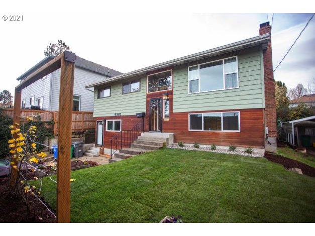 8325 Southwest Terwilliger Boulevard Portland, OR 97219 - Photo 2 of 30 a front view of house with yard and outdoor seating