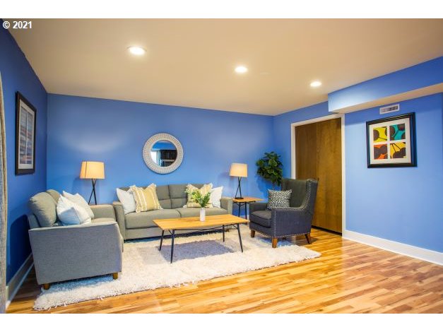 8325 Southwest Terwilliger Boulevard Portland, OR 97219 - Photo 21 of 30 a living room with furniture and a table