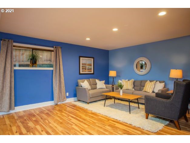 8325 Southwest Terwilliger Boulevard Portland, OR 97219 - Photo 22 of 30 a living room with furniture and a table