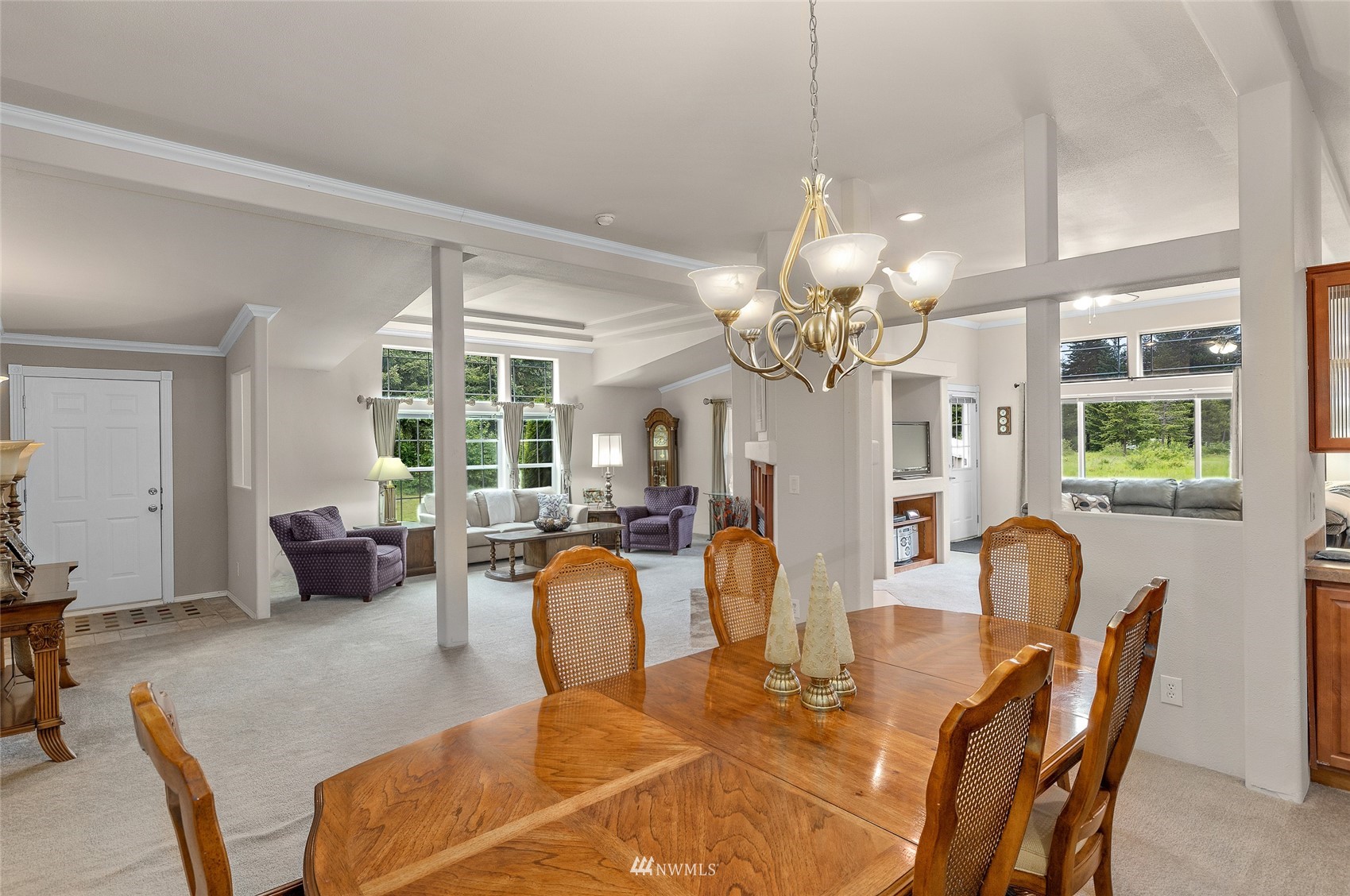 6746 Nelson Siding Road Cle Elum, WA 98922 - Photo 11 of 27 a view of a dining room with furniture and a chandelier