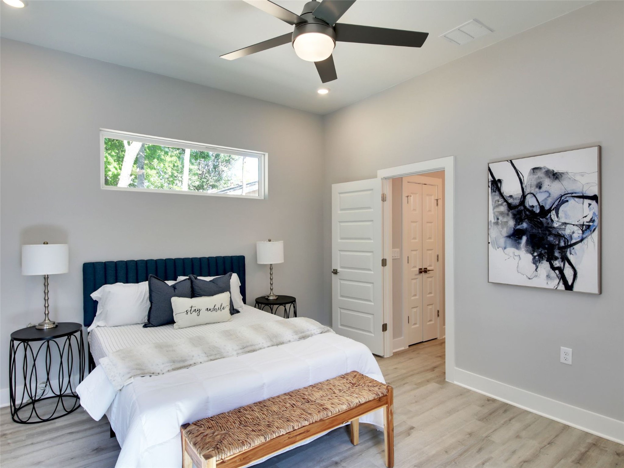 6111 Carnation Terrace, Unit 1 Austin, TX 78741 - Photo 19 of 23 a bedroom with a bed and a painting on the wall