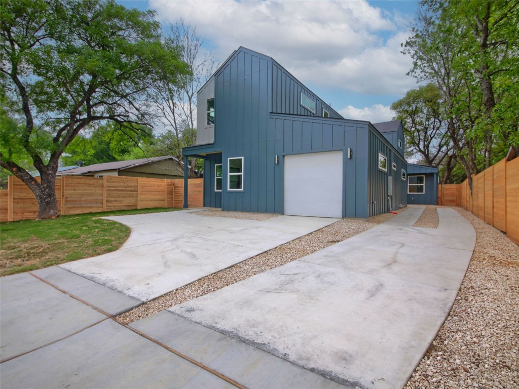 6111 Carnation Terrace, Unit 1 Austin, TX 78741 - Photo 3 of 23 a view of a house with a yard and tree