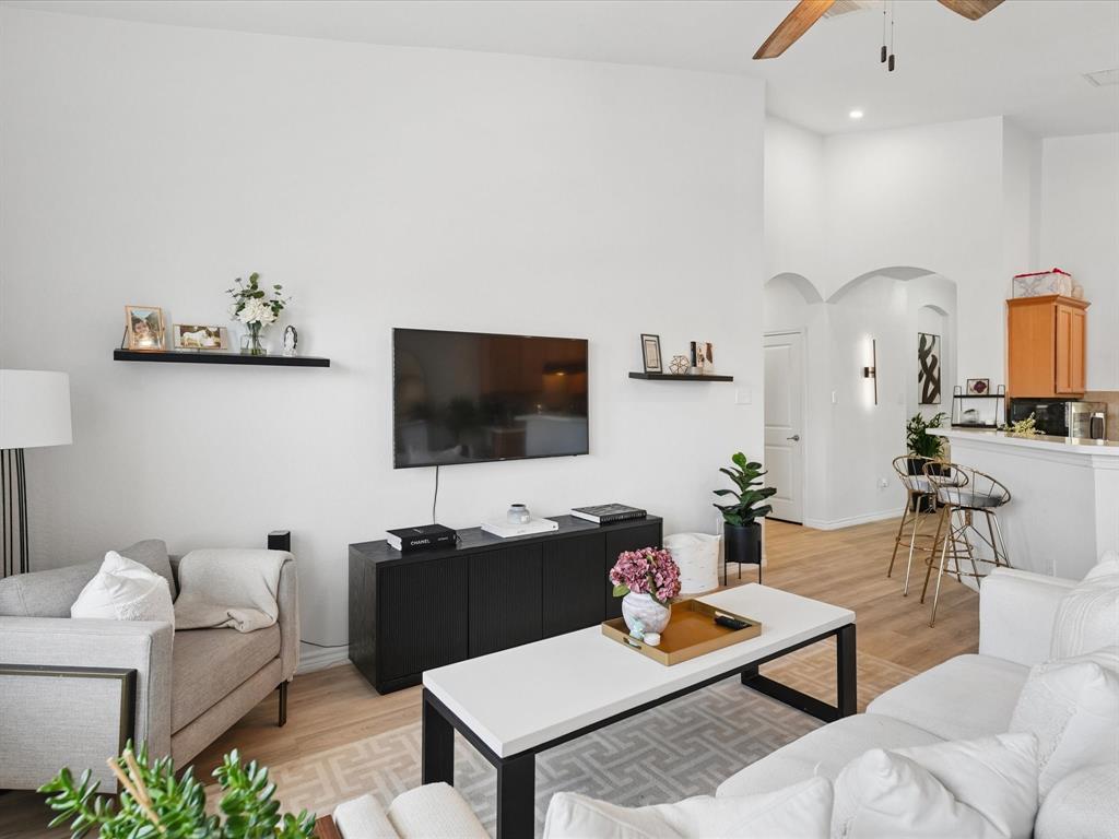 6527 Portside Ridge Lane Dallas, TX 75249 - Photo 15 of 30 a living room with furniture and a flat screen tv