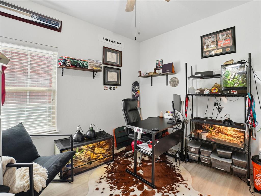 6527 Portside Ridge Lane Dallas, TX 75249 - Photo 24 of 30 a room with furniture and a window