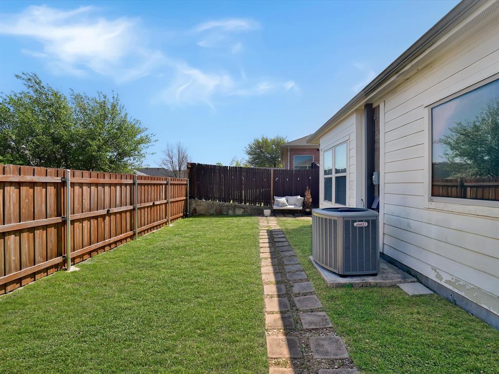 6527 Portside Ridge Lane Dallas, TX 75249 - Photo 28 of 30 a view of a backyard with sitting area