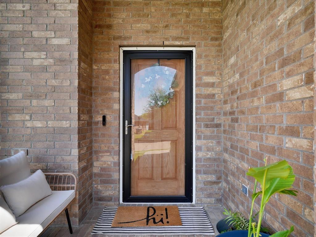 6527 Portside Ridge Lane Dallas, TX 75249 - Photo 6 of 30 a door with brick wall