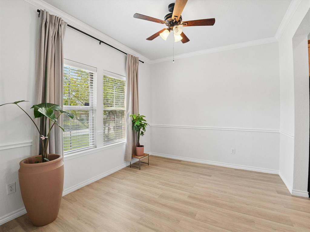 6527 Portside Ridge Lane Dallas, TX 75249 - Photo 8 of 30 a view of a livingroom with a ceiling fan and window