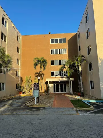a front view of a building with street view