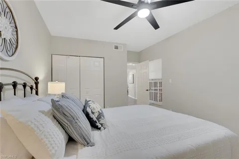 a bedroom with a bed and closet