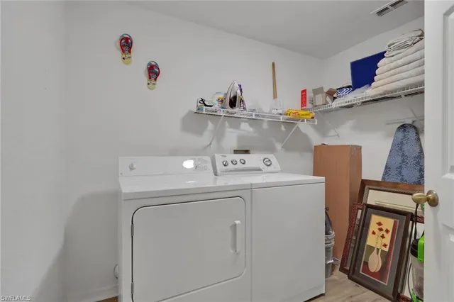 a utility room with dryer and washer
