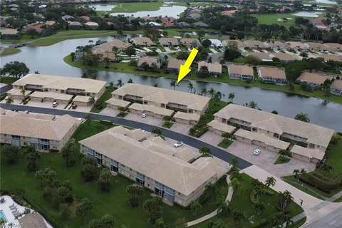 an aerial view of a house with a swimming pool and outdoor space