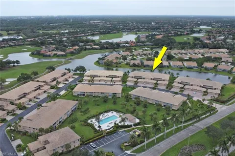 an aerial view of a house with a swimming pool yard and outdoor seating
