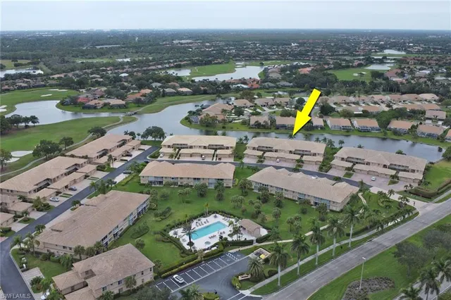 an aerial view of a house with a swimming pool yard and outdoor seating