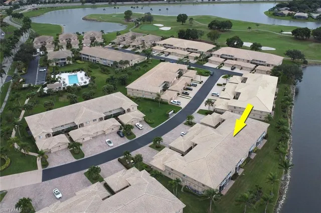 an aerial view of a house with outdoor space