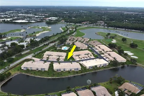 an aerial view of a house with a lake view