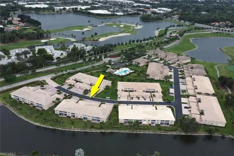 an aerial view of a house with a lake view