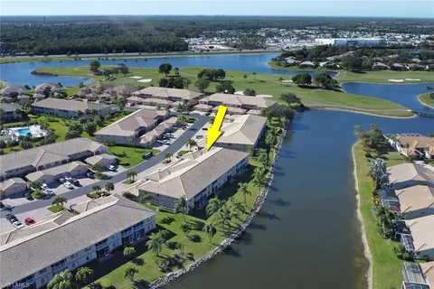 an aerial view of a house with a swimming pool yard and outdoor seating