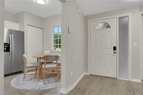 a view of a livingroom with furniture and a window
