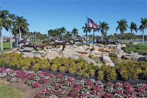 a group of people sitting in a backyard of a house