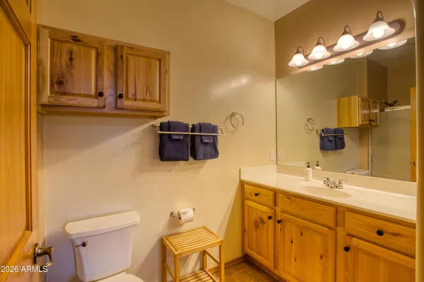 a bathroom with a glass shower door