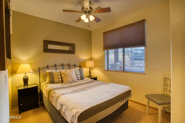 a bathroom with a sink a toilet and shower curtain